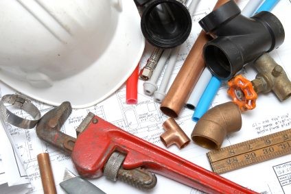 Plumbing parts, tools, and plans used by Liberty Plumbing & Drain.
